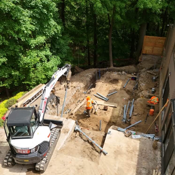 membrane protection helical pile underpinning